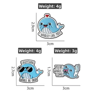 Detail view of cartoon whale enamel pins with size dimensions and weight info