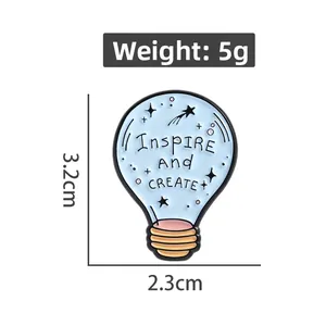 Detail view of light blue enamel bulb pin showing 3.2cm height and 2.3cm width