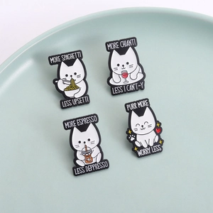Set of four funny white cat enamel pins with coffee and pasta puns on a blue plate