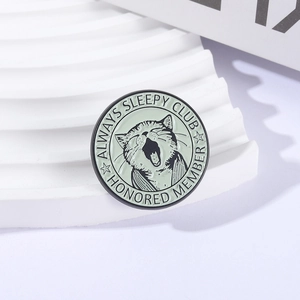 Cartoon yawning cat enamel pin badge with Always Sleepy Club text in mint green