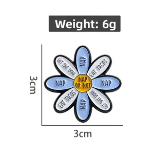 Detail shot of a blue and white daisy enamel pin with motivational text on white background