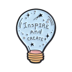 Inspirational light bulb brooch in light blue with Inspire And CREATE lettering
