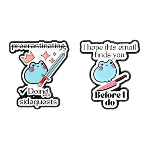 Cute cartoon frog enamel pins featuring crowns and swords with funny office humor slogans