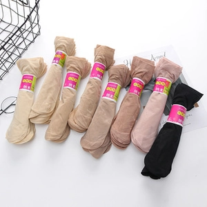 Selection of ultra-thin silk socks in diverse skin tones with stylish paper packaging