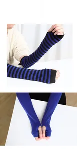 Detailed knit texture of striped and solid arm warmers with thumb holes for winter