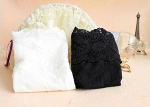 Detail of floral lace trim on black and white strapless tube tops for women