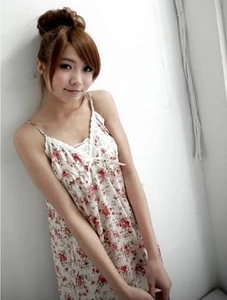 Close-up of floral camisole dress with delicate white lace trim and bow knot detail