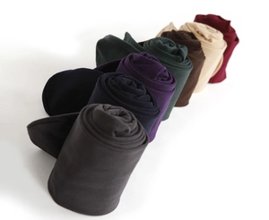 Texture detail of thick thermal knit leggings in various solid colors for winter