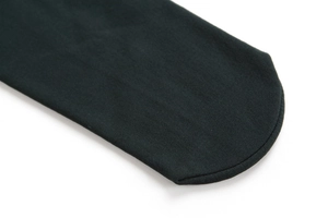 Detailed close-up of premium black knitted leggings featuring reinforced flat curved seams