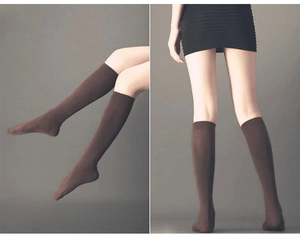 Detail of brown sheer knee-high school socks with a wide non-slip ribbed cuff design