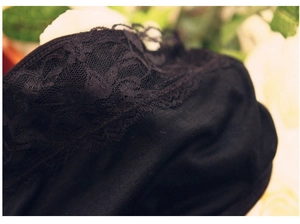 Close-up of the delicate black lace trim on a women's bamboo fiber bandeau bra