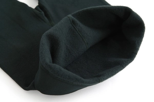 Macro detail of high-waisted thermal leggings featuring thick fleece lining for winter