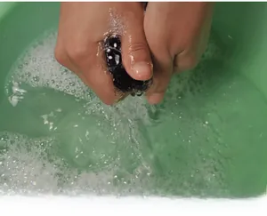 Wash test showing fleece-lined leggings in water to prove colorfastness and dye quality