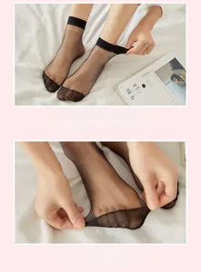 Detail of ultra-thin black sheer socks showing reinforced toes and elastic cuffs