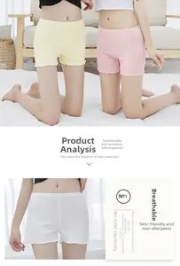 Detail of ruffle hem safety shorts for women in light yellow, pink and white soft cotton