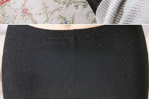 Detailed view of high-density glossy fabric on black leggings featuring snag-resistant texture