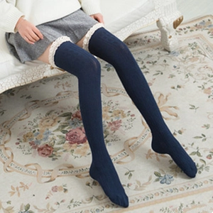 Navy blue over-the-knee cotton socks with cream lace trim and vertical knit pattern