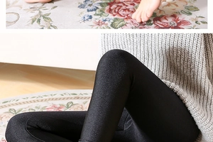 Detailed view of black glossy leggings with high elasticity and a silky shine finish
