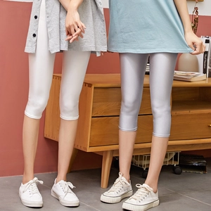 Women high elastic glossy cropped leggings in white and silver blue for yoga and leisure