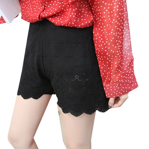 Women's black high-waisted safety shorts with elegant floral lace hem and scallop trim