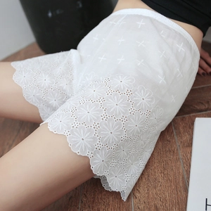 White cotton safety shorts featuring daisy lace hollow embroidery and elastic high waist