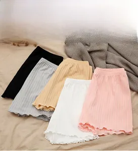 Detail showing various colors of ruffled hem safety shorts in breathable ribbed fabric