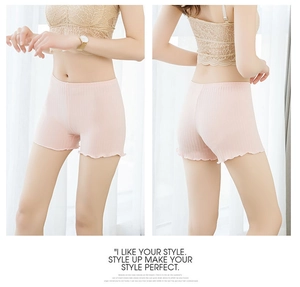 Front and back view of pink ribbed safety shorts with elegant ruffled hem edges