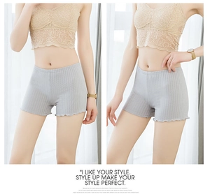 Detail of light gray ribbed safety shorts for women with elegant ruffled hem edges
