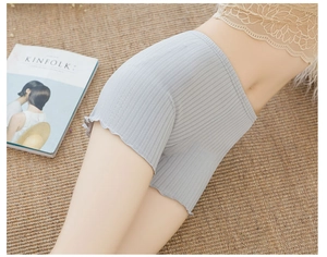 Close-up of light grey ribbed safety shorts featuring elegant ruffled lettuce edges