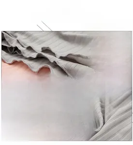 Close-up of breathable ribbed knit fabric with elastic waistline in grey and pink colors