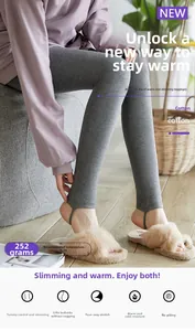 Close-up of grey high-waist thermal leggings with stirrup design and 252g thickness