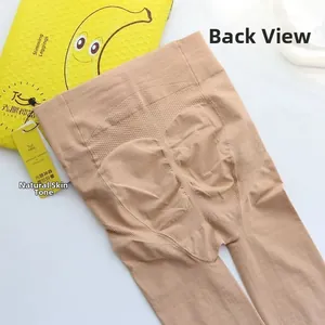 Detail view of skin-tone slimming tights with back shaping seams and graphene packaging
