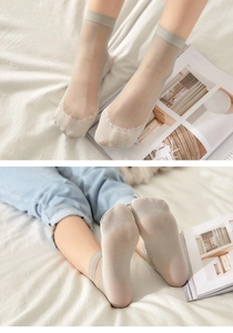 Detailed view of light beige lace-trimmed sheer ankle socks with cotton bottom for women