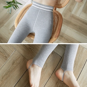 High-waisted grey thermal stirrup leggings with striped waistband for winter wear