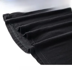 Close-up of black modal camisole hem featuring neat double-needle stitching and knit texture