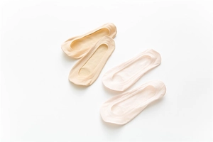 Detail view of seamless beige invisible boat socks with a smooth elastic finish
