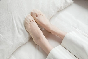 Close-up of beige invisible low-cut socks showing the smooth ice silk texture and fit