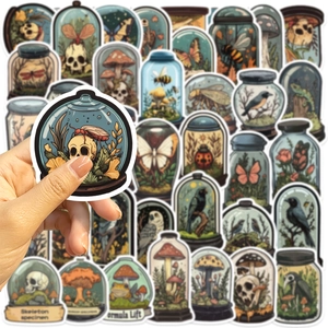 Detailed view of vintage gothic stickers featuring skeleton specimens and insects