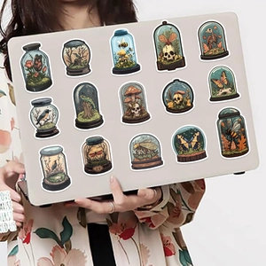 50 Gothic skull and botanical stickers on a laptop showcasing vintage aesthetic art