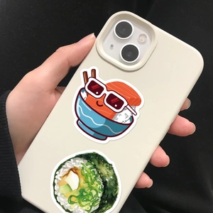 Close-up of cute cartoon sushi stickers applied on a smartphone back for DIY decoration