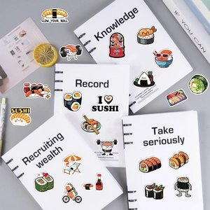 Detailed view of creative cartoon sushi stickers on a notebook with various cute designs
