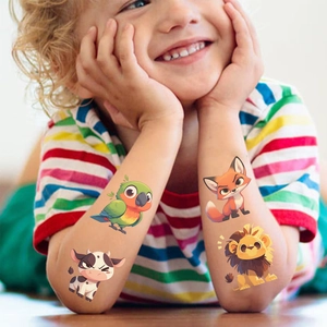 Child wearing cute waterproof cartoon animal temporary tattoos on arms for party