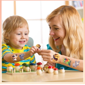 Waterproof cartoon animal temporary tattoos featuring cow and lion for kids party gift