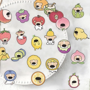 50 cute cartoon fruit dog stickers on a white ceramic plate for DIY decoration