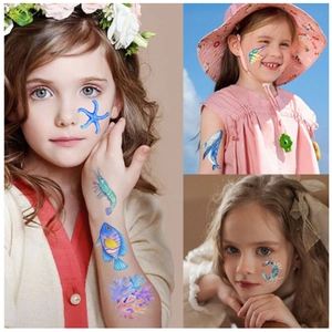 Detailed view of colorful ocean theme temporary tattoos on a child's face and arms