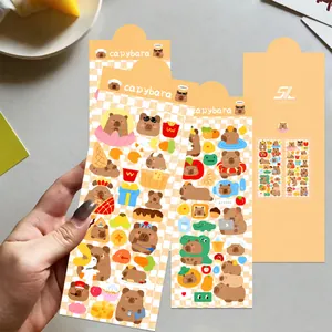 Dettaglio di due fogli di adesivi capibara in PET per la decorazione di diari fai-da-te