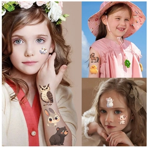 Kids wearing waterproof cartoon animal temporary tattoos with owl and rabbit designs