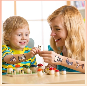 Waterproof cartoon animal temporary tattoos being applied during parent-child playtime