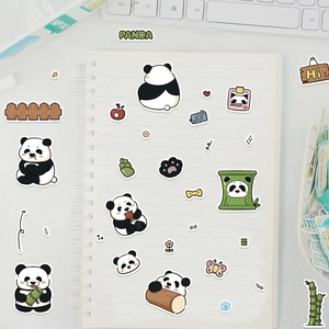 Cute panda cartoon stickers set on a spiral notebook with a creative stationary scene