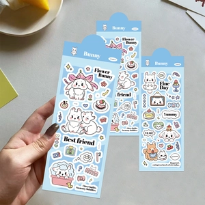 Detailed view of cute cartoon bunny stickers for DIY journals in fresh light blue themes
